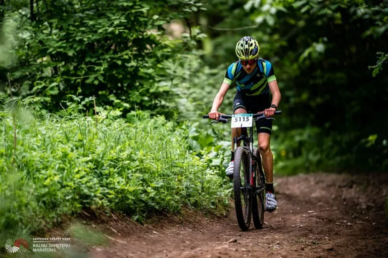 MTB riders racing through forest at an LVM event
