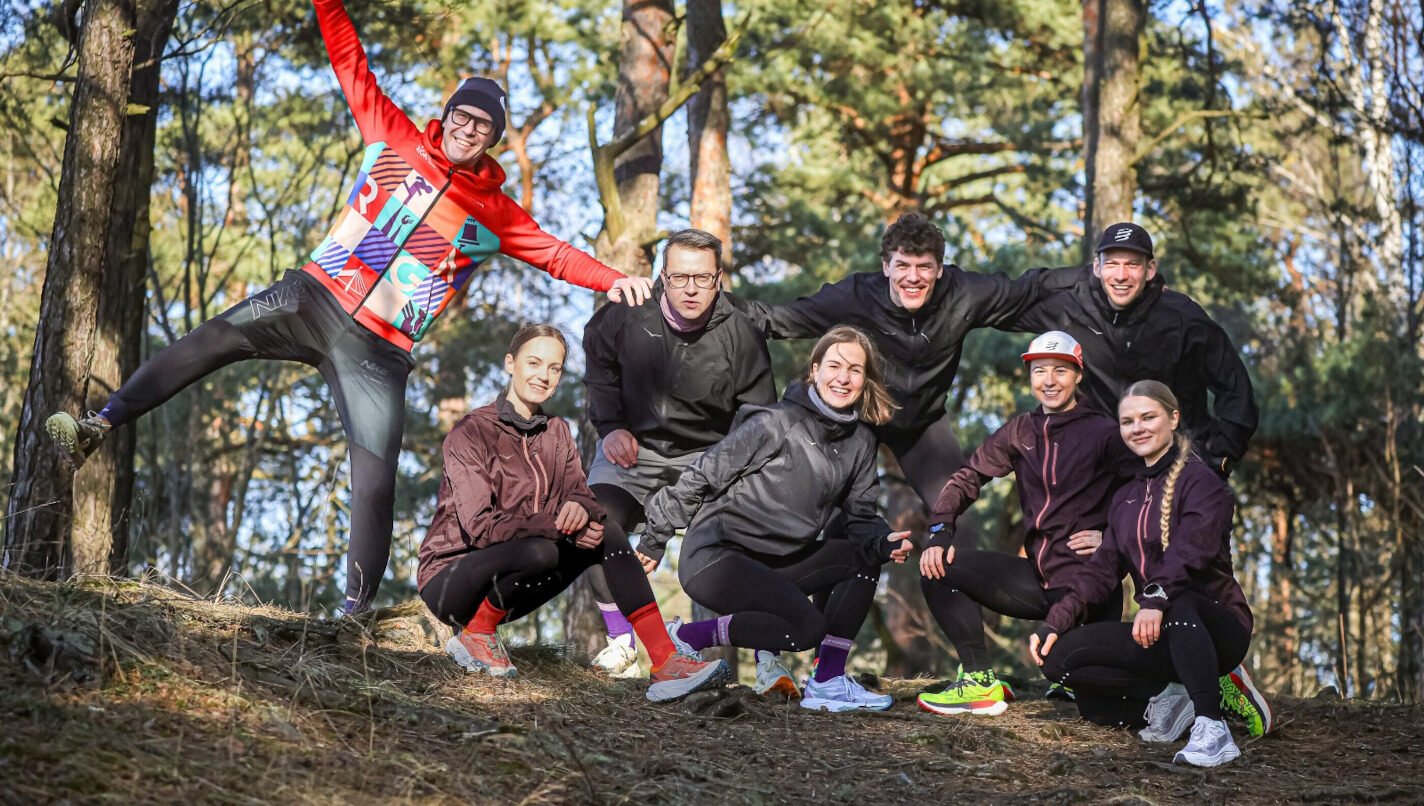 Group of trail runners on a forest course