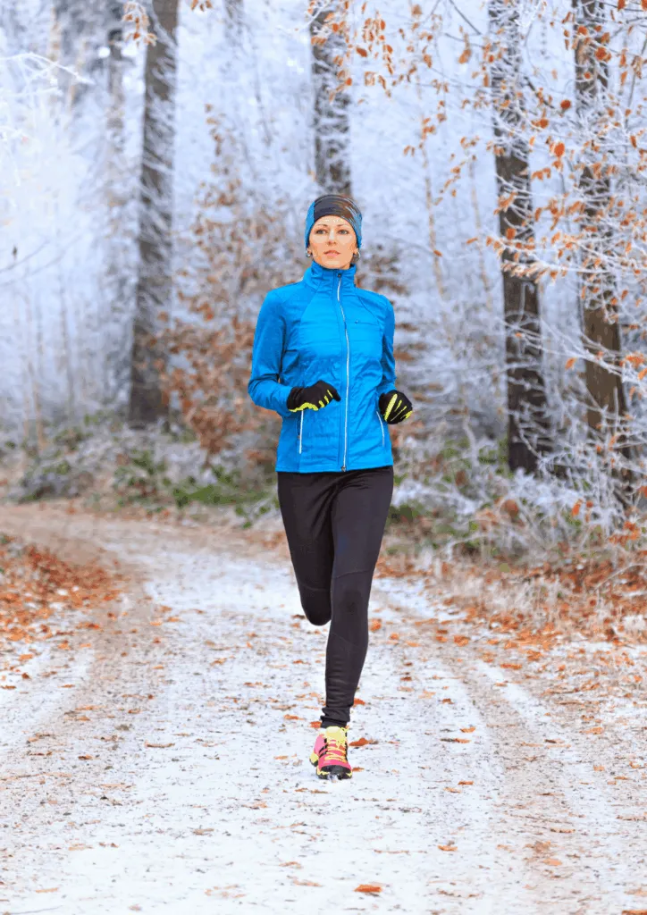 Runner training on a snowy winter path