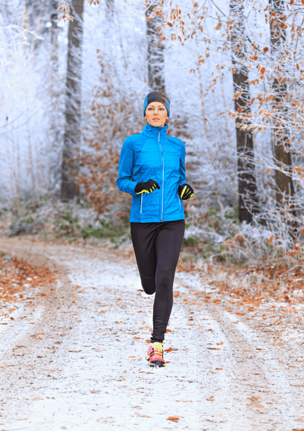 Runner training on a snowy winter path